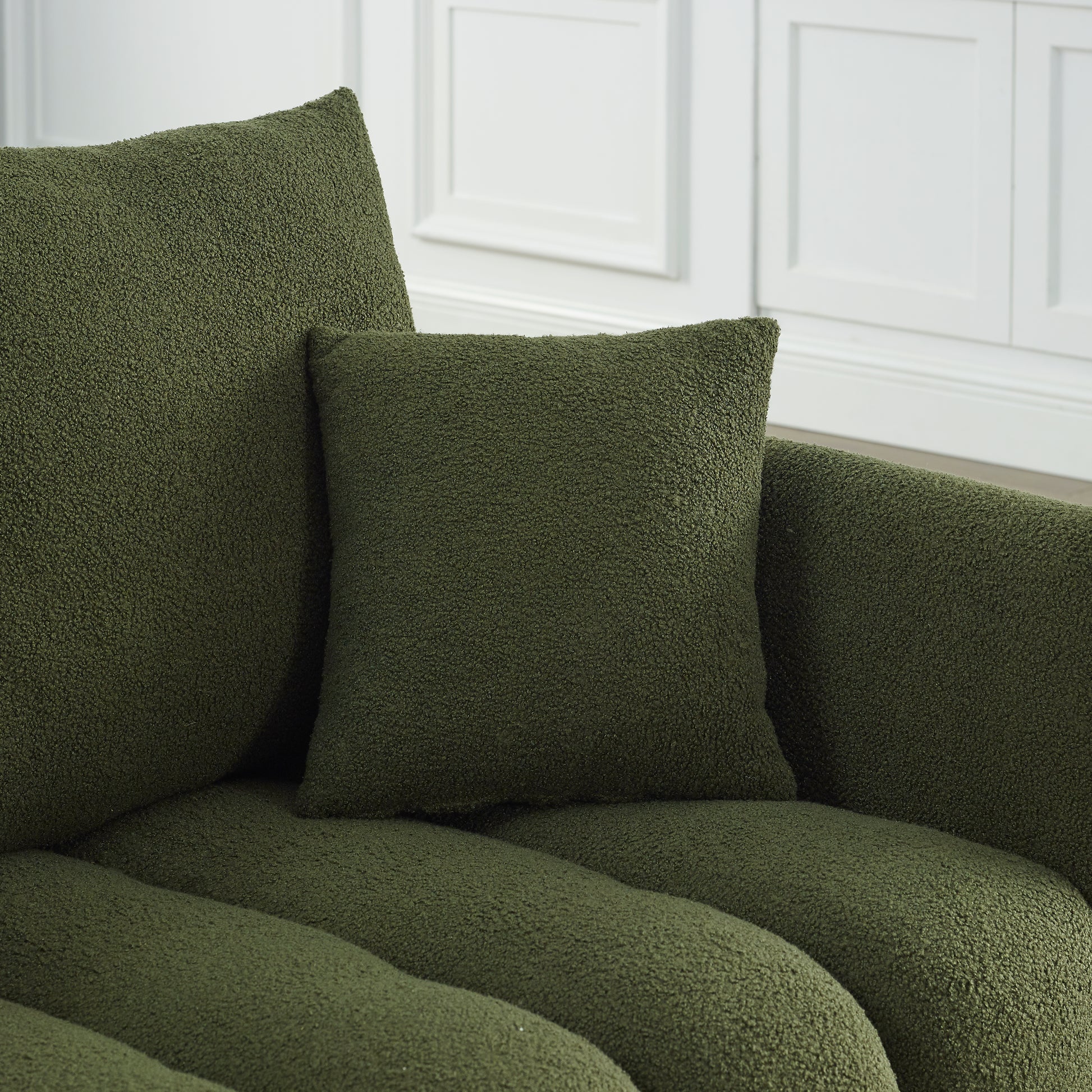 Plush green throw pillow with boucle texture for cozy living room decor