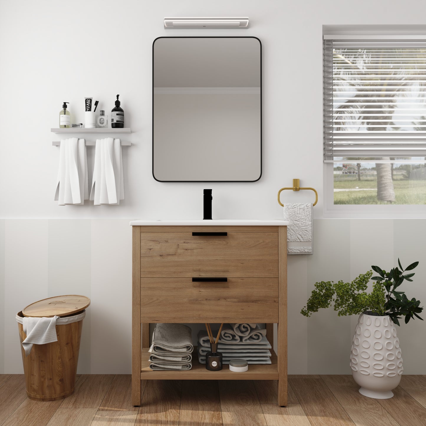 Modern oak bathroom vanity with white countertop and black hardware featuring open shelving for towels