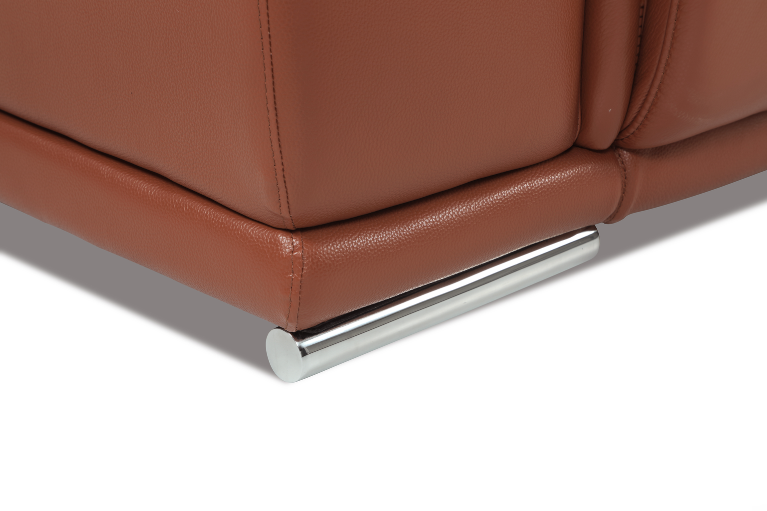 Brown leather couch corner with modern chrome leg detail