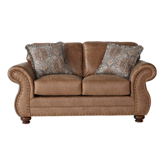 Brown leather sofa with decorative pillows and studded arms