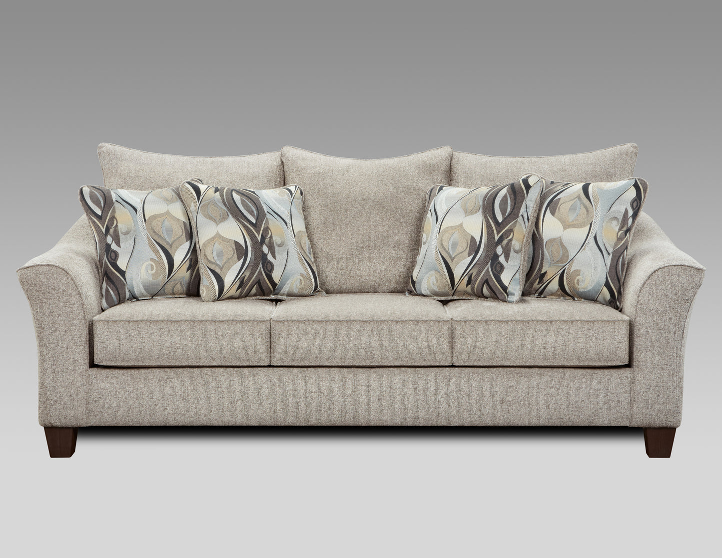 Neutral textured fabric sofa with four abstract patterned accent pillows