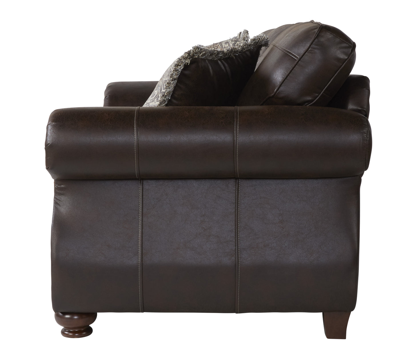 Dark brown leather armchair with decorative pillows and stitched detailing