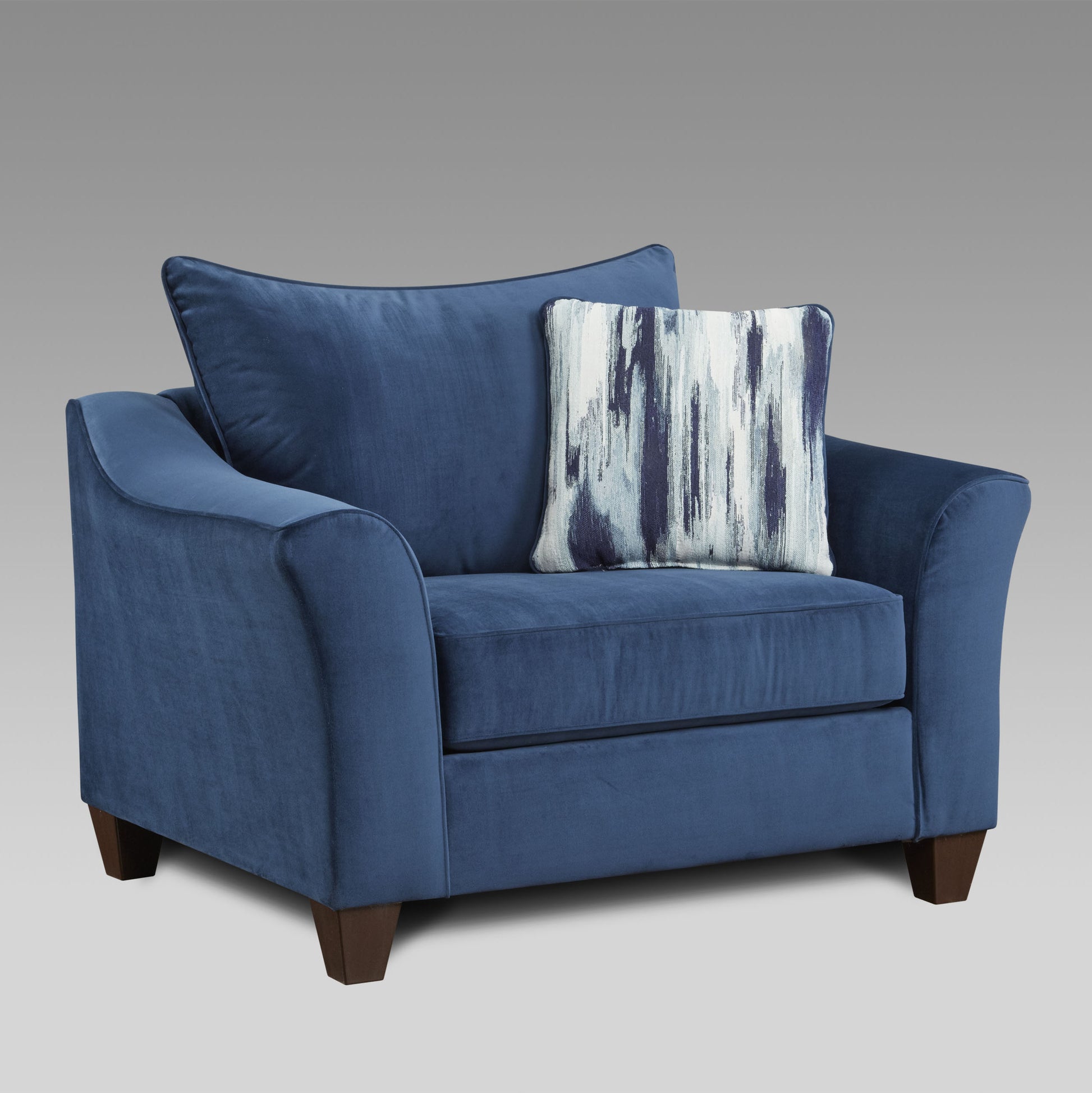 Navy blue velvet armchair with abstract patterned throw pillow
