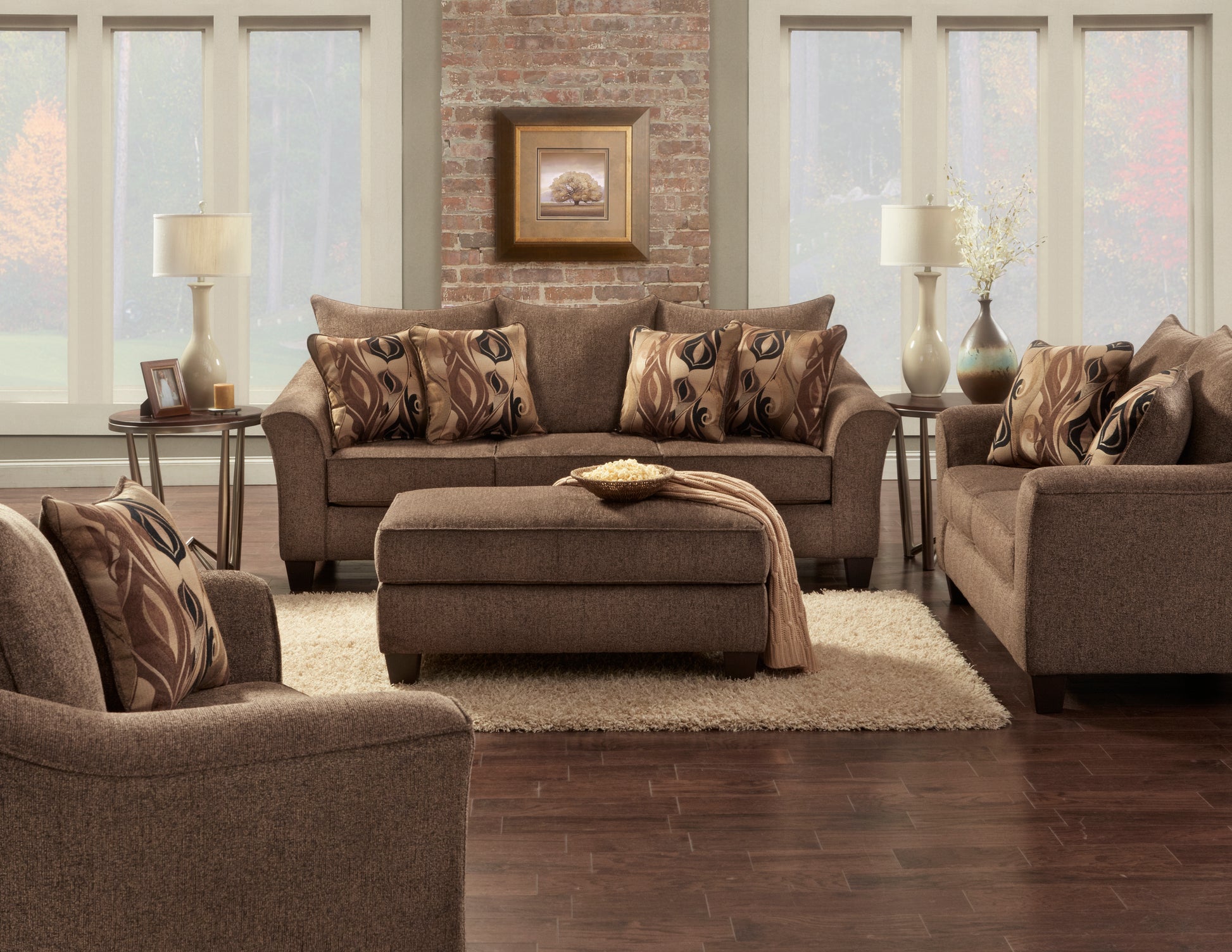 Brown fabric sofa set with decorative pillows and ottoman for living room comfort