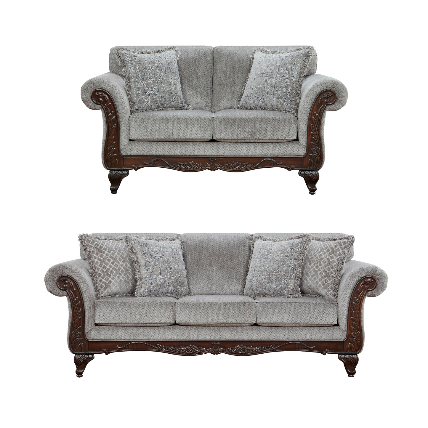 Elegant grey fabric loveseat with ornate dark wood trim and patterned throw pillows