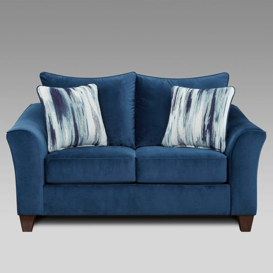 Navy velvet loveseat with modern abstract pattern throw pillows perfect for small apartments