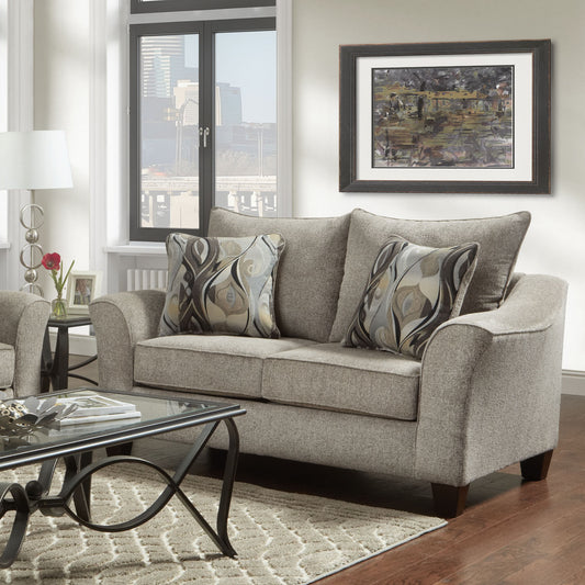 Textured grey loveseat with decorative pillows for living room seating