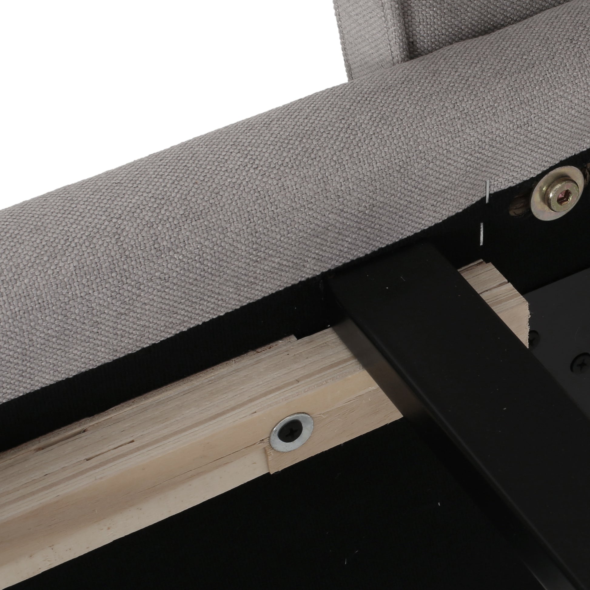 Close up of gray upholstered furniture frame with visible wooden supports and metal hardware