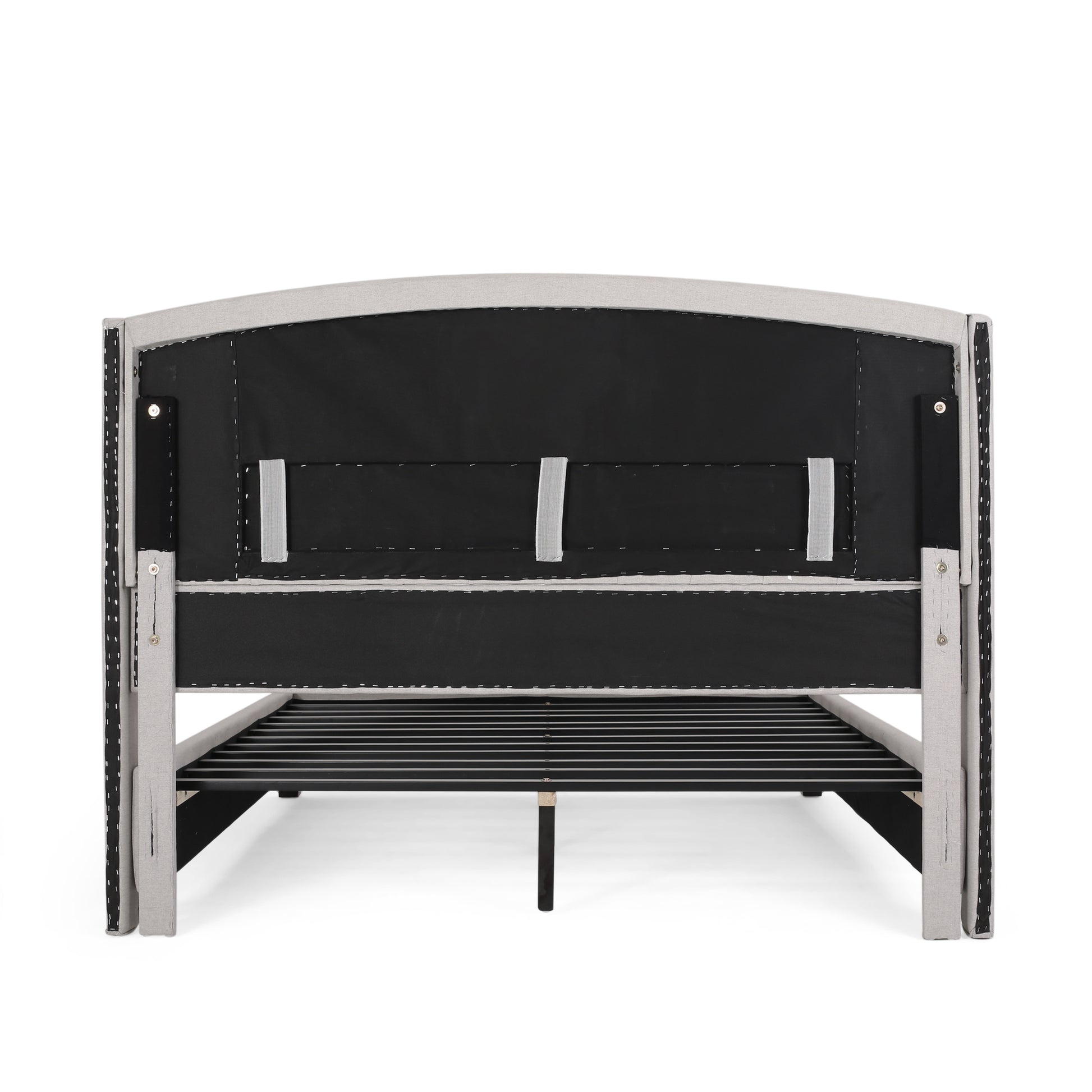 Light grey upholstered bed frame shown from the back with metal slats