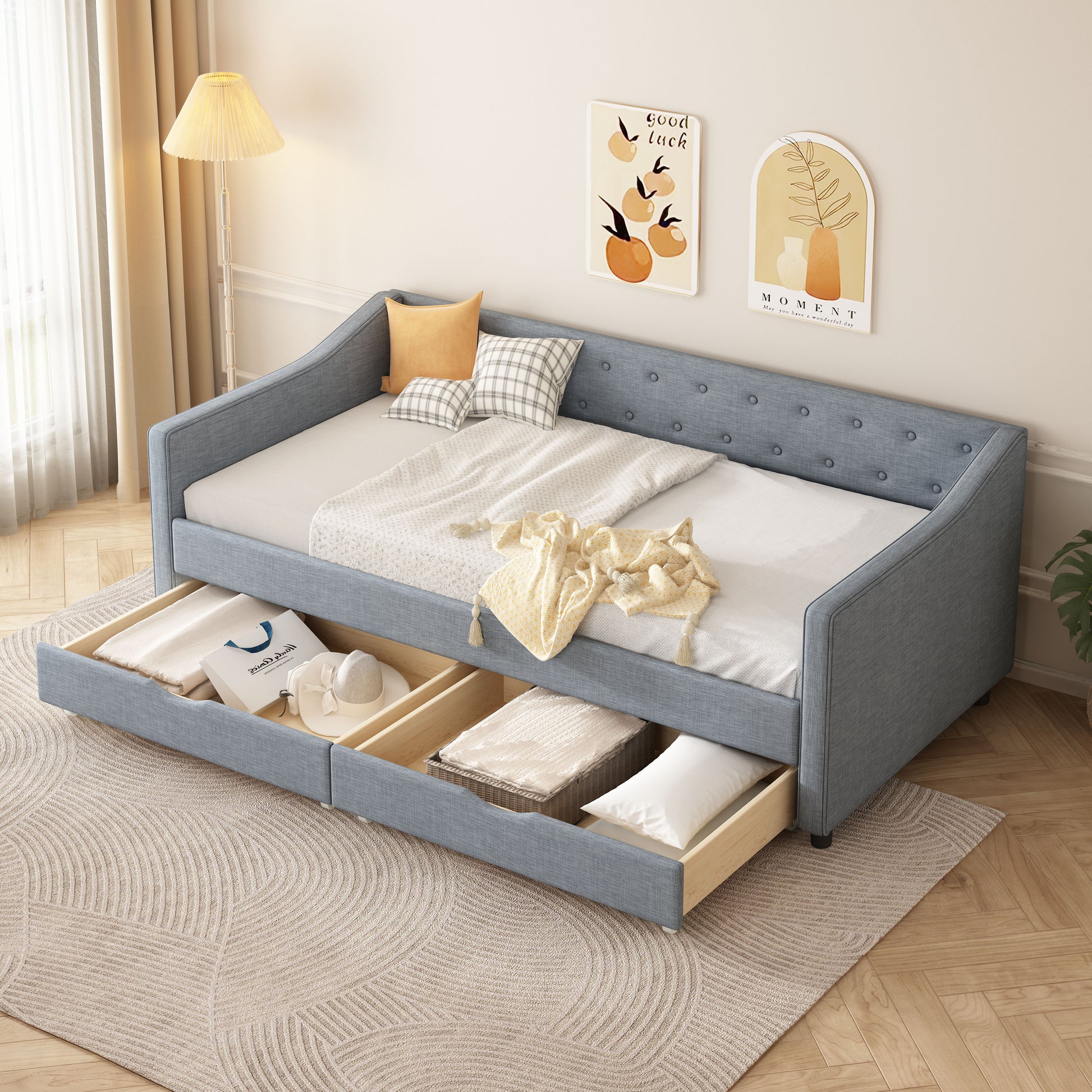 Blue upholstered daybed with storage drawers and button tufted back