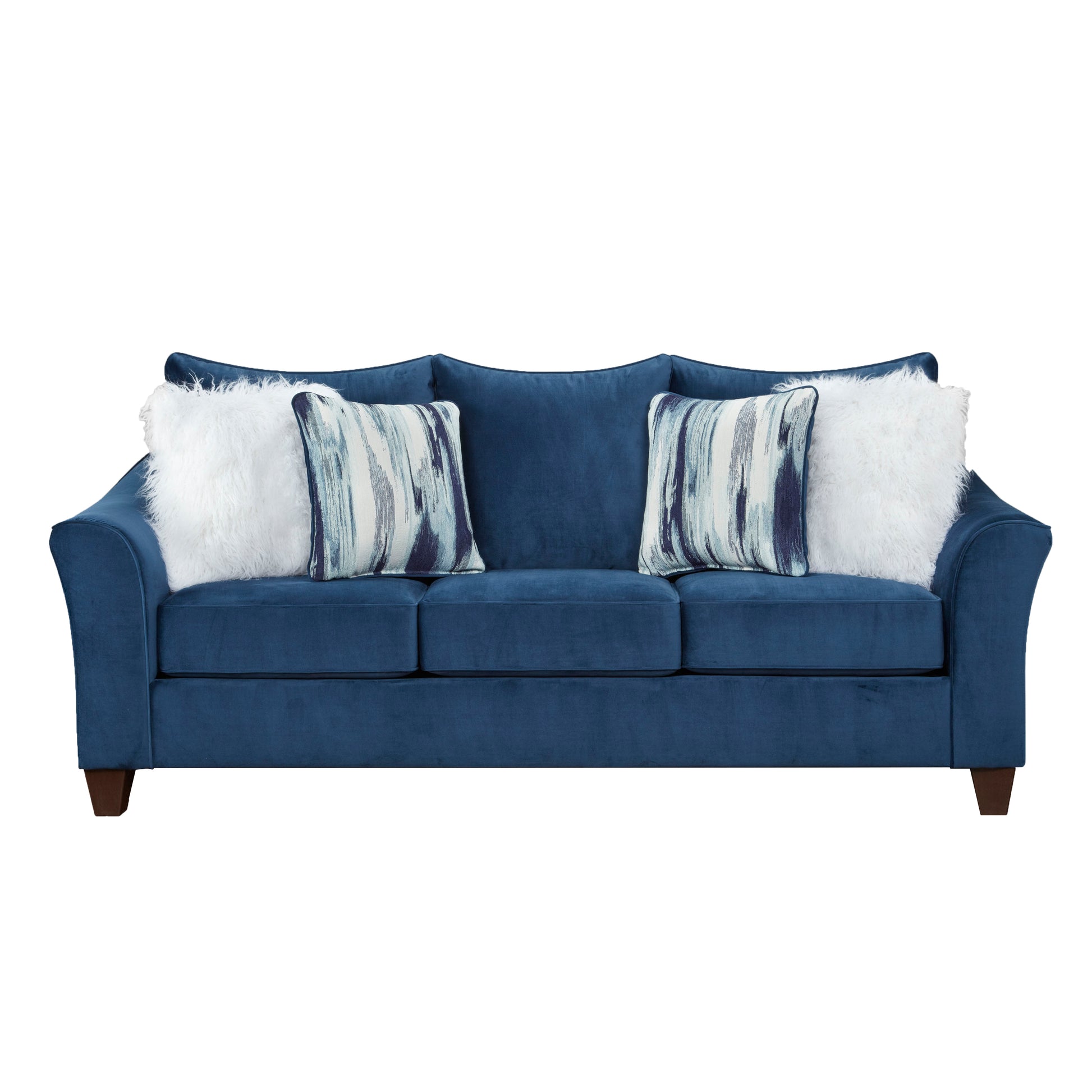 Deep blue velvet sofa with plush white and patterned throw pillows perfect for a living room