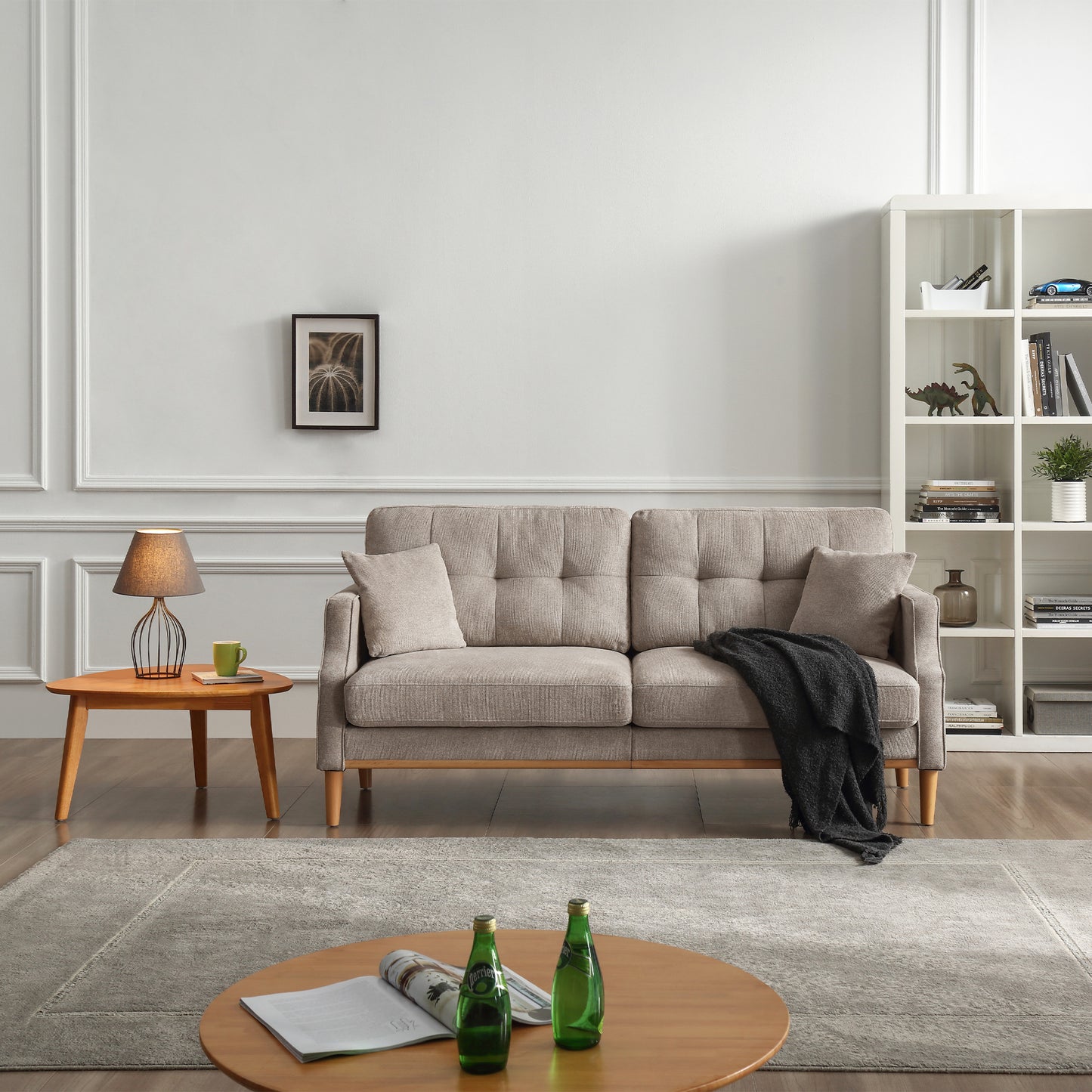 Textured taupe fabric sofa with tufted cushions and wooden legs perfect for living room seating
