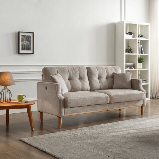 Tufted beige fabric sofa with natural wood accents and decorative pillows