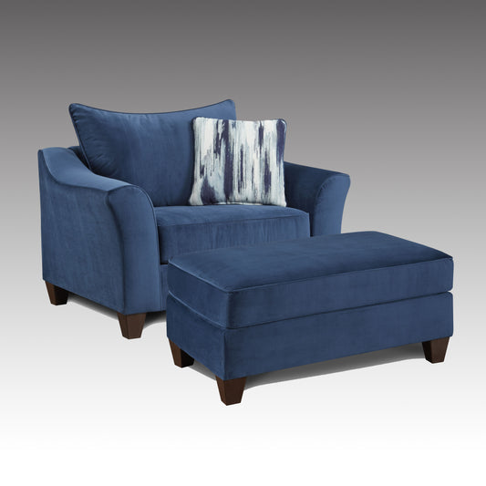 Navy blue velvet accent chair with matching ottoman and abstract patterned pillow