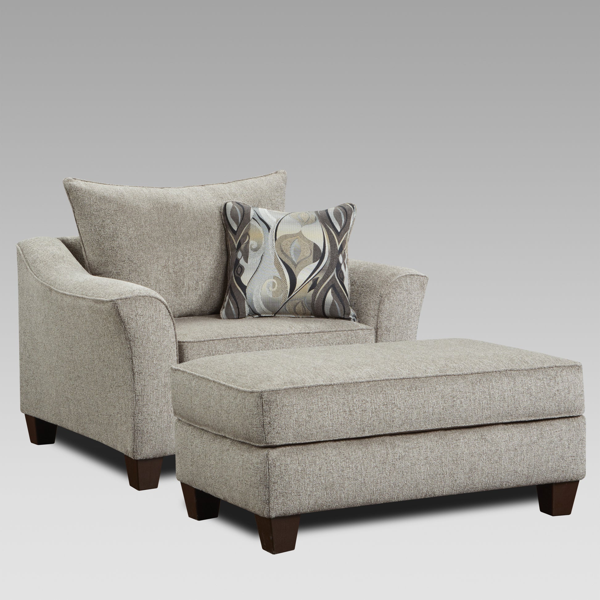 Comfortable grey fabric armchair with matching ottoman and decorative pillow