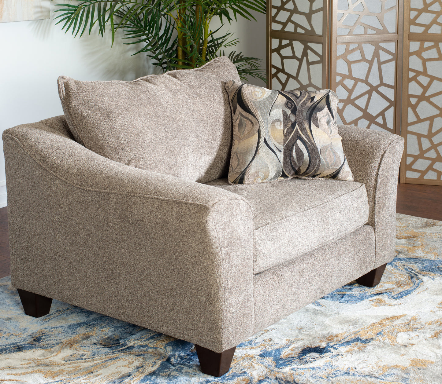 Plush taupe fabric armchair with decorative throw pillow perfect for living room comfort