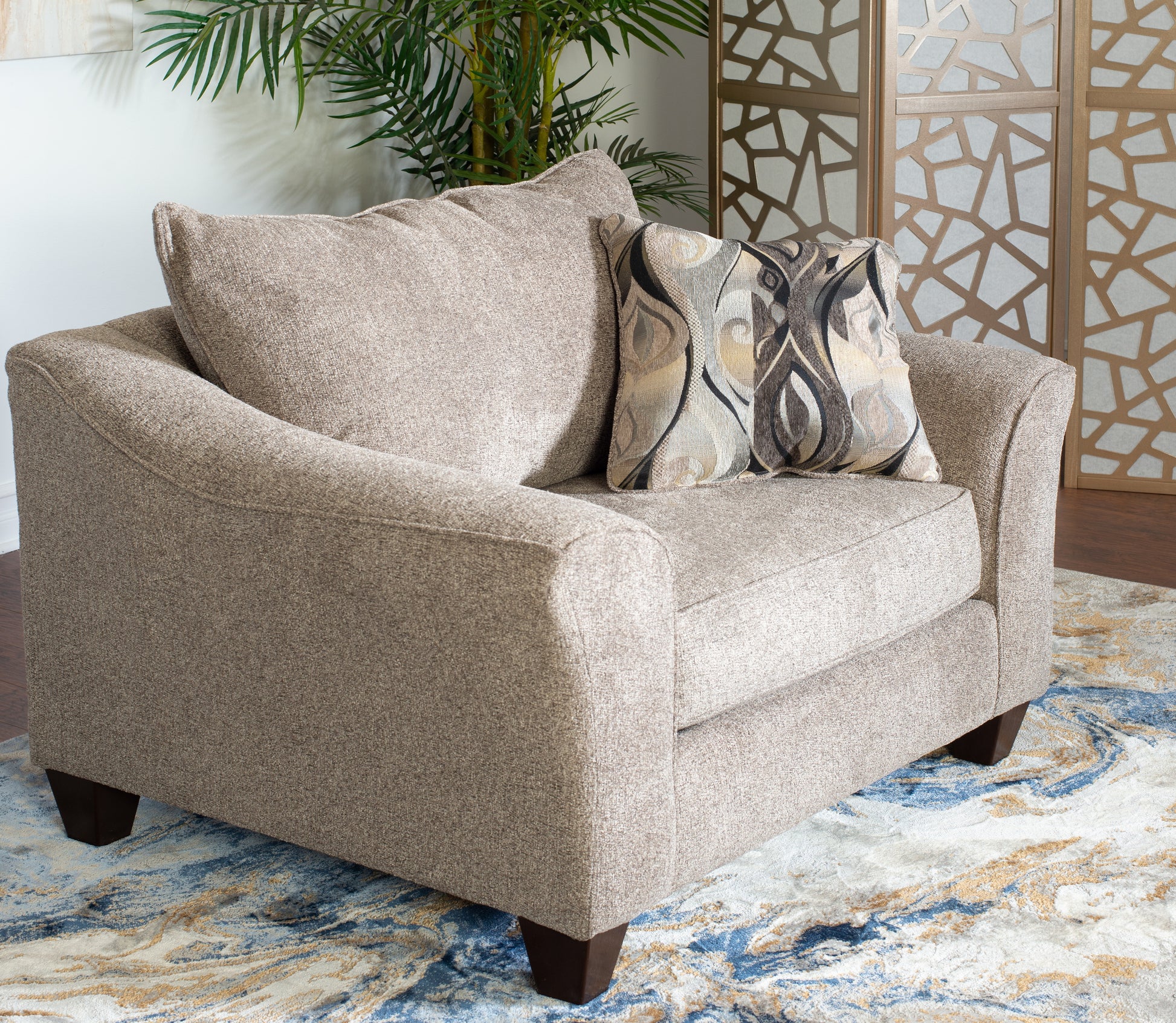 Plush taupe fabric armchair with decorative throw pillow perfect for living room comfort