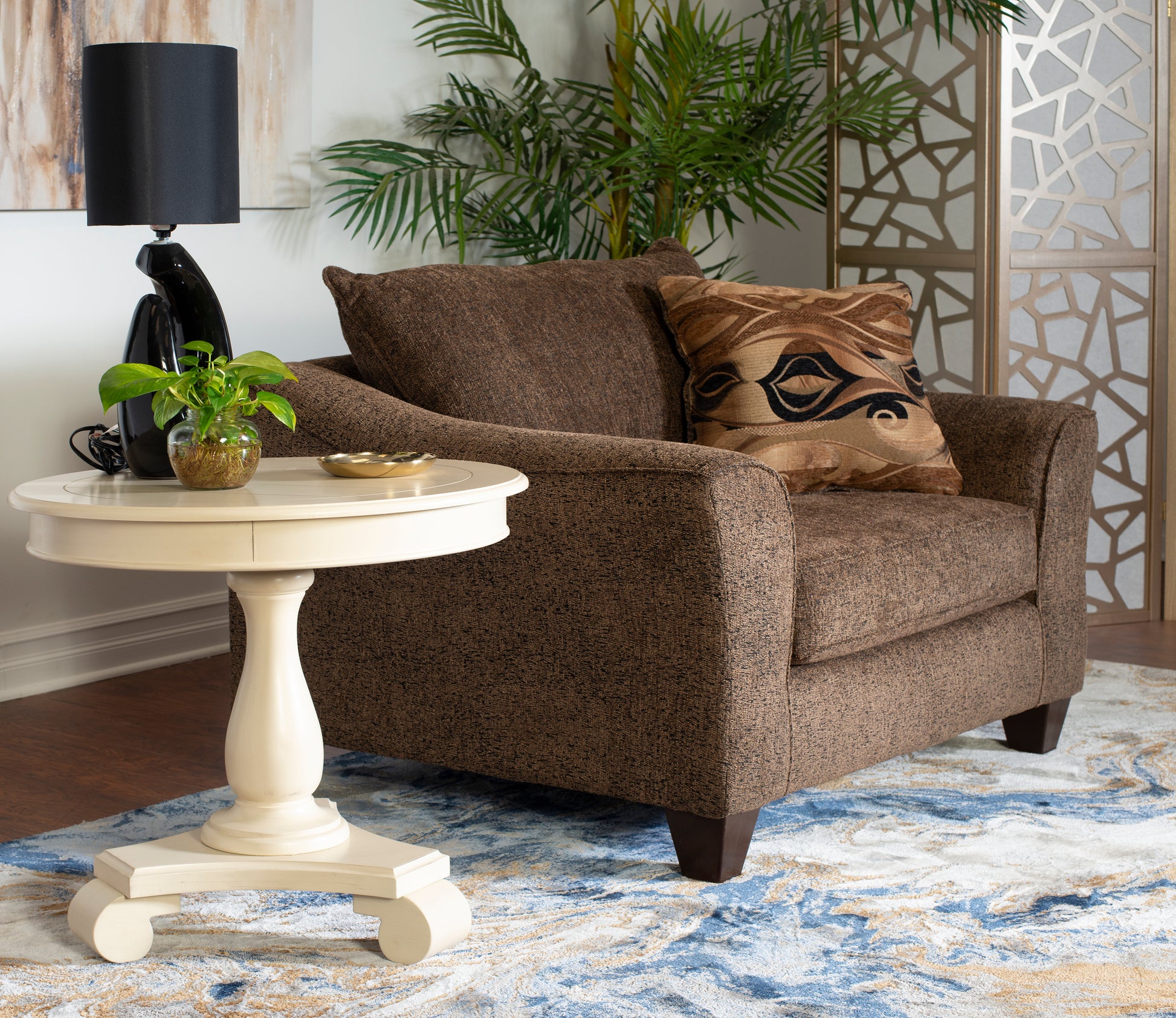 Brown textured accent chair with decorative throw pillow perfect for living rooms