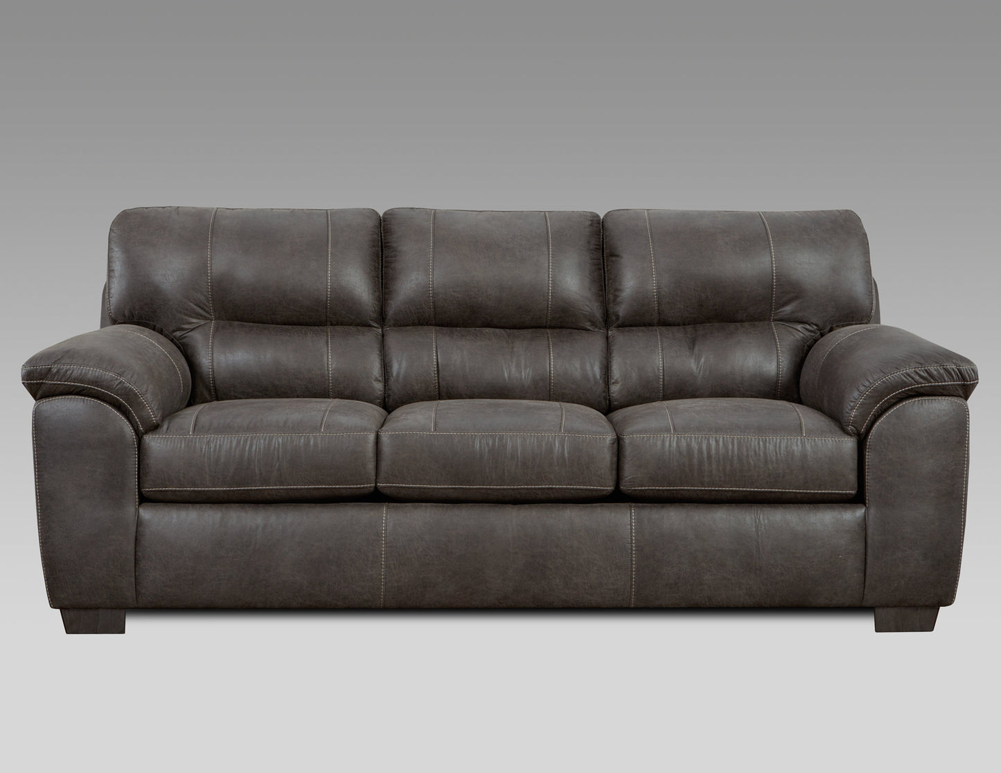 Dark brown leather reclining sofa with plush cushions and contrast stitching