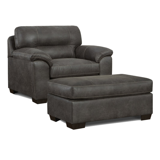 Dark gray leather armchair and matching ottoman with contrast stitching perfect for living room comfort