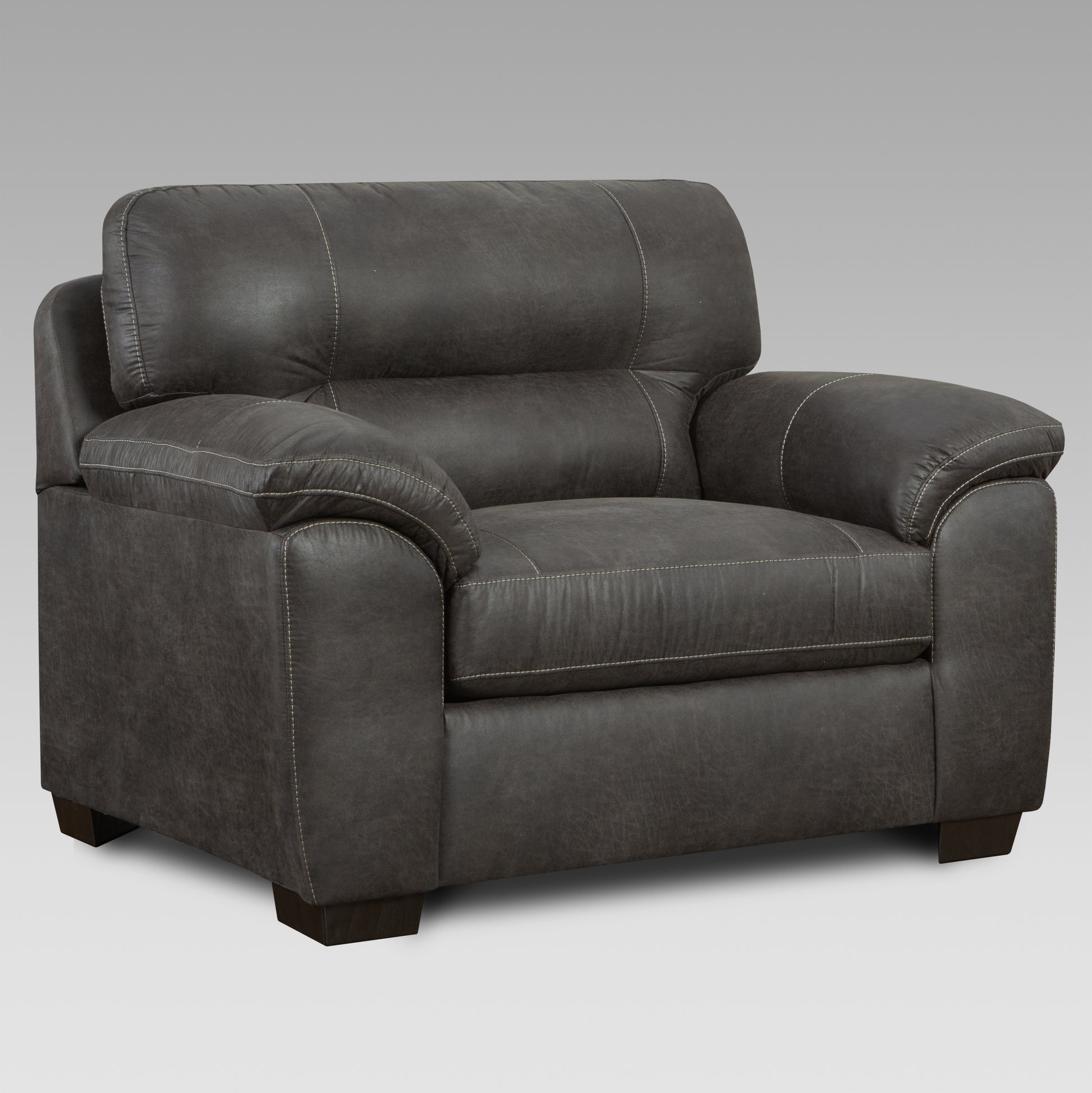 Dark grey leather armchair with white stitching and plush cushioning