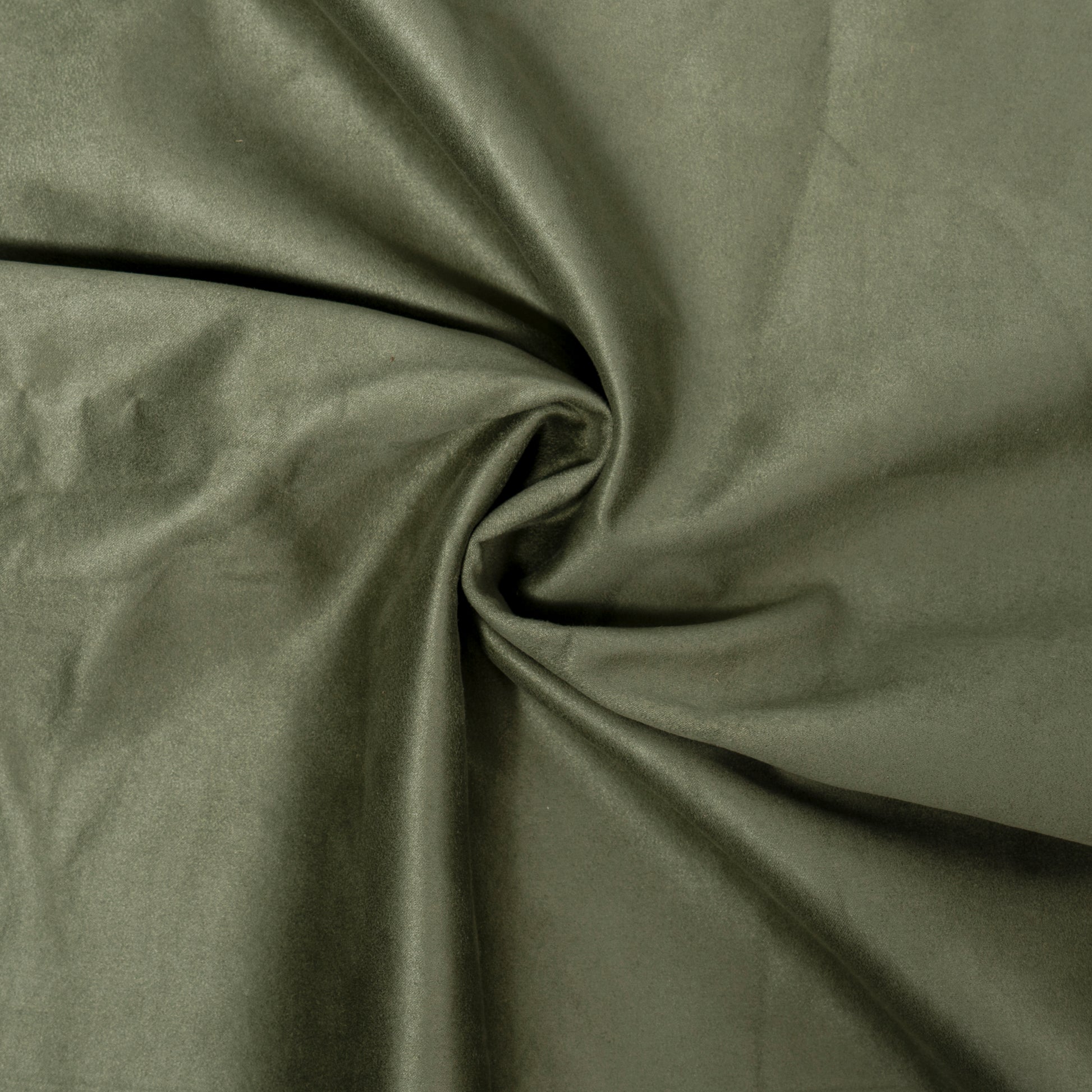 Soft olive green suede fabric draped and folded ideal for upholstery and fashion
