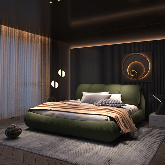 Plush green velvet bed with white and houndstooth pillows and tan throw