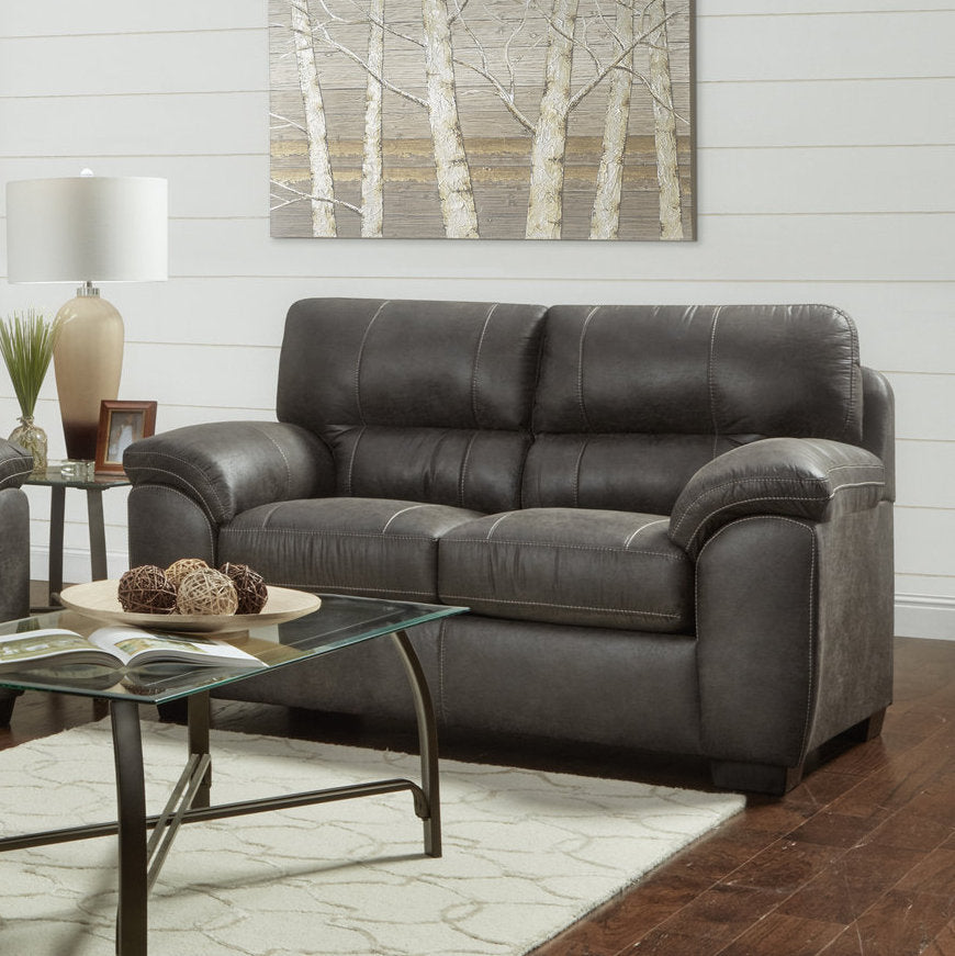 Dark brown leather sofa with decorative stitching perfect for living rooms