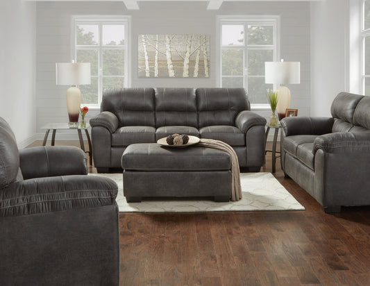 Dark grey leather sofa with plush cushions and contrast stitching for modern living rooms