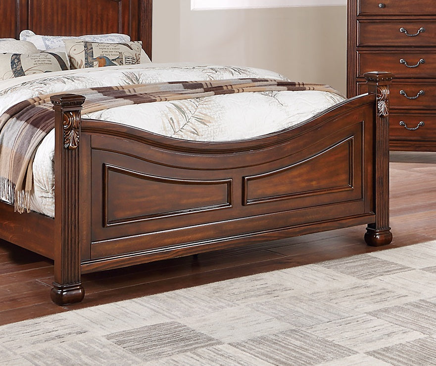 Rich mahogany wood bed frame with carved fluted posts and curved headboard panel