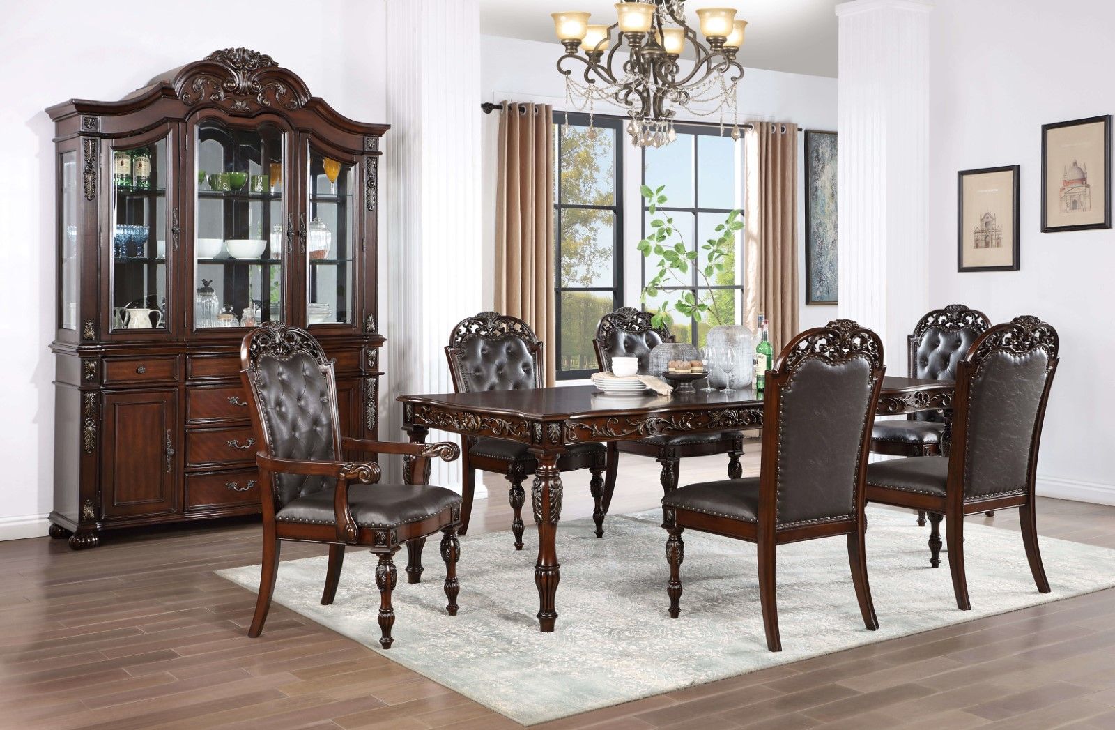 Ornate dark wood dining table set with tufted leather chairs and matching buffet