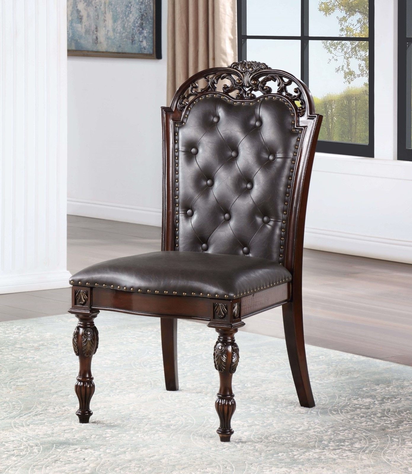 Ornate dark brown tufted leather dining chair with carved wood frame