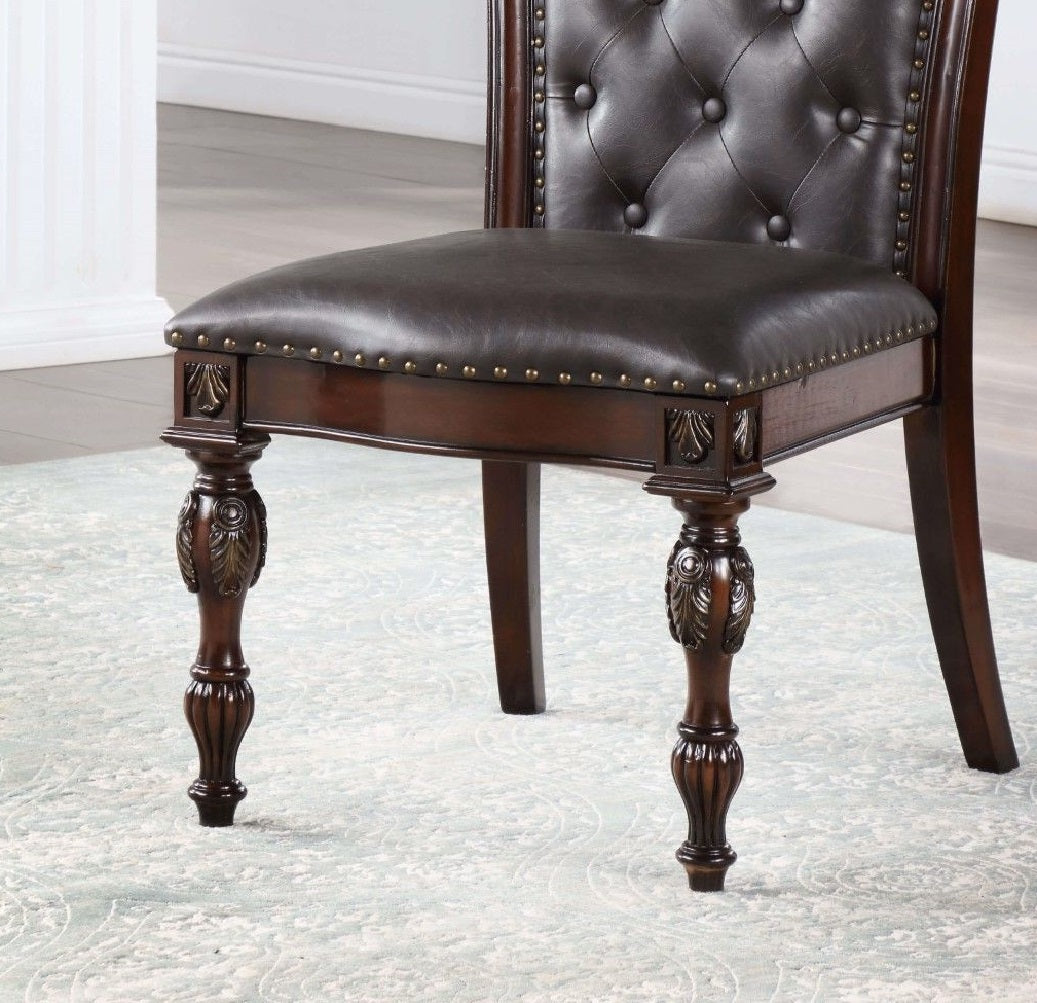 Dark brown leather dining chair with tufted back and ornate carved legs