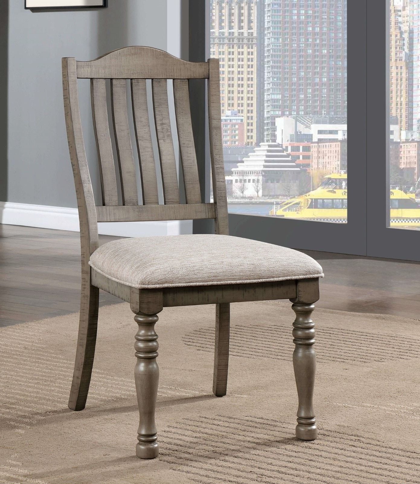 Rustic grey wooden dining chair with a textured beige upholstered seat