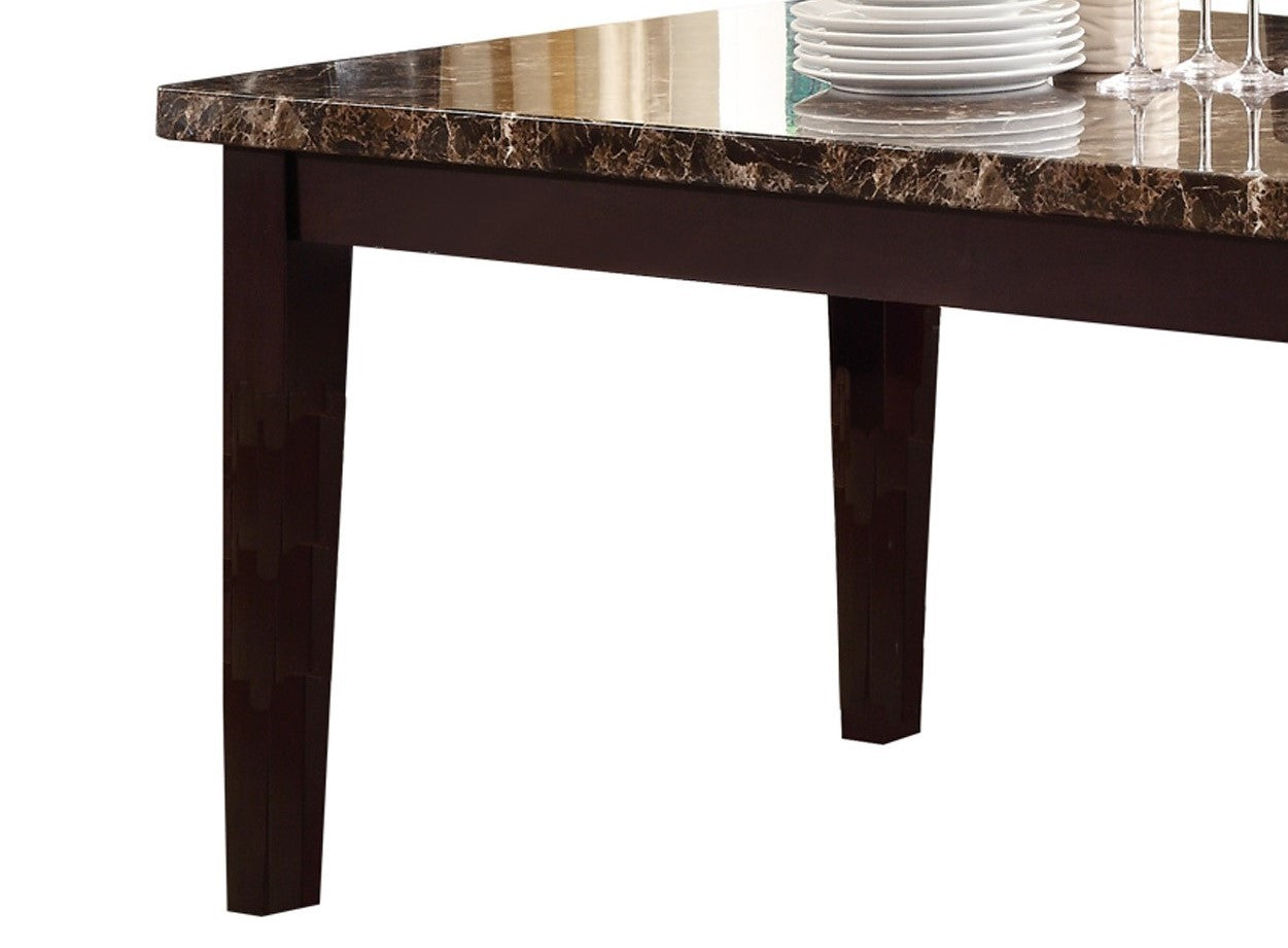 Dark brown dining table with faux marble top and tapered legs