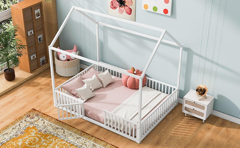 White wooden house bed frame with guardrails and pink bedding