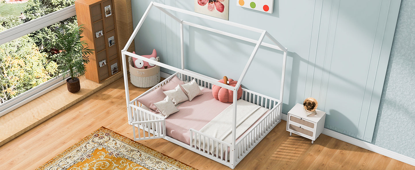 White wooden house bed frame with pink bedding and pillows