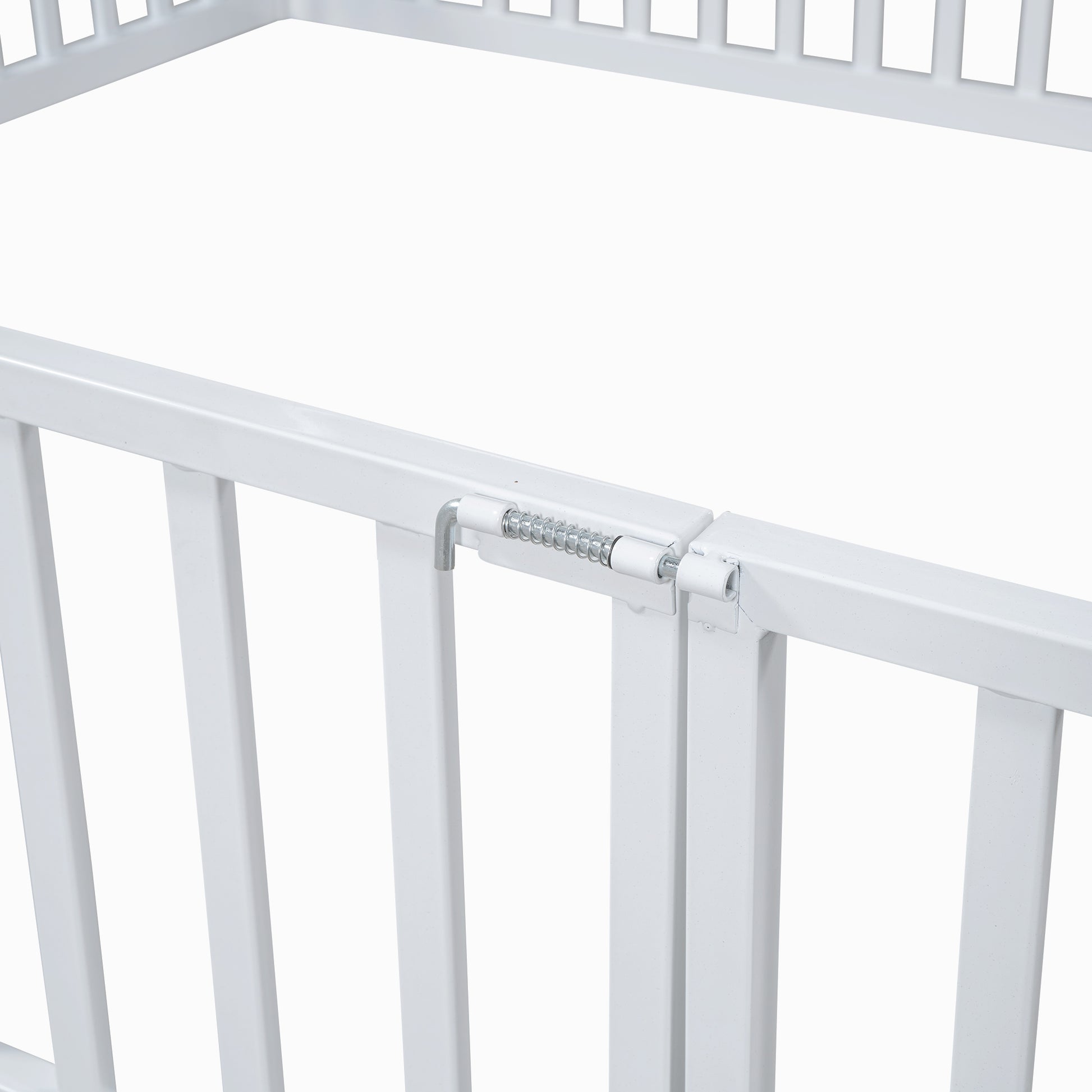White metal safety gate latch detail with spring mechanism