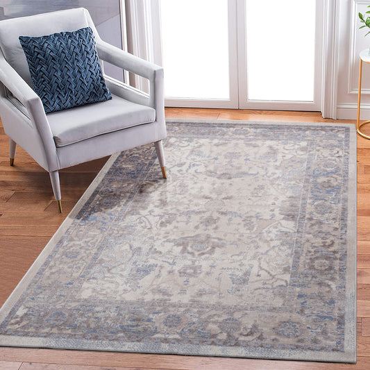 Cream and blue distressed Persian rug with intricate floral patterns