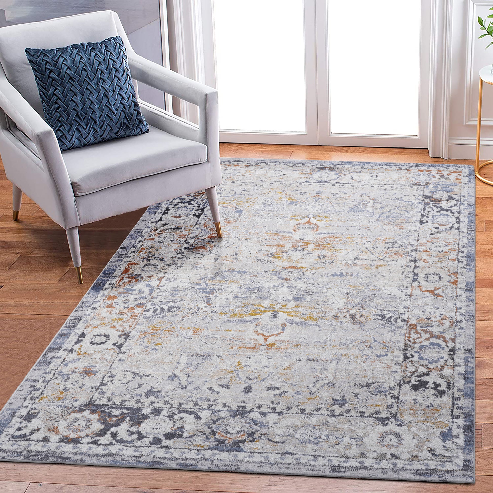 Distressed vintage oriental rug in muted grey blue and gold tones perfect for living rooms