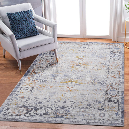 Distressed vintage oriental rug in muted grey blue and gold tones perfect for living rooms