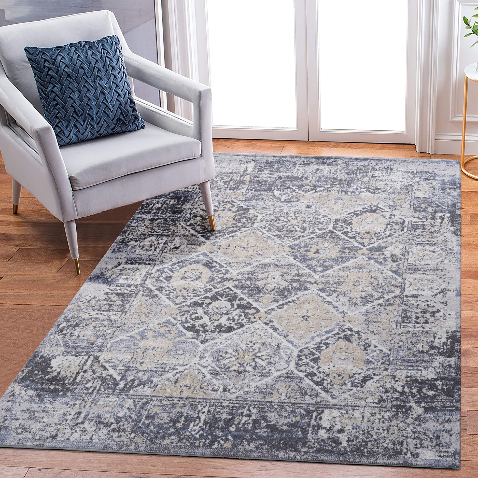 Distressed grey and cream Persian rug with intricate floral pattern and soft texture