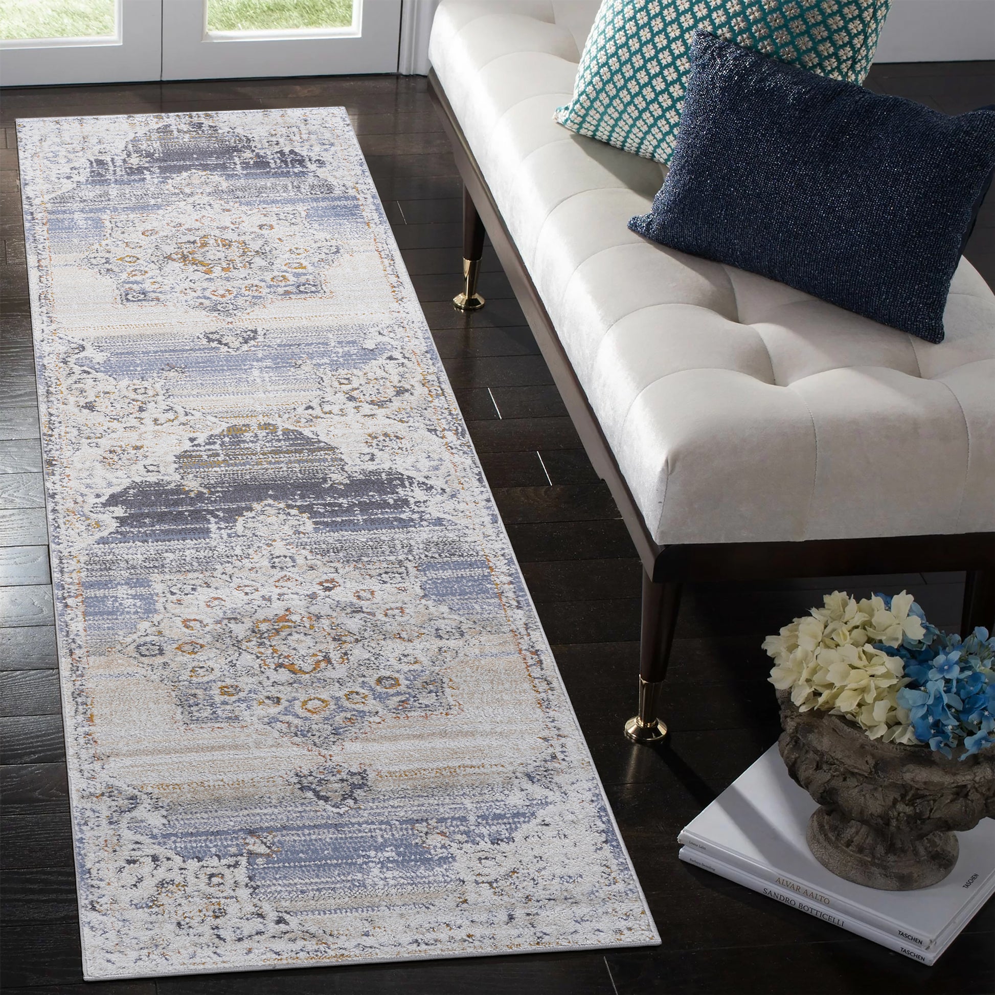 Distressed gray and cream abstract runner rug with muted blue accents