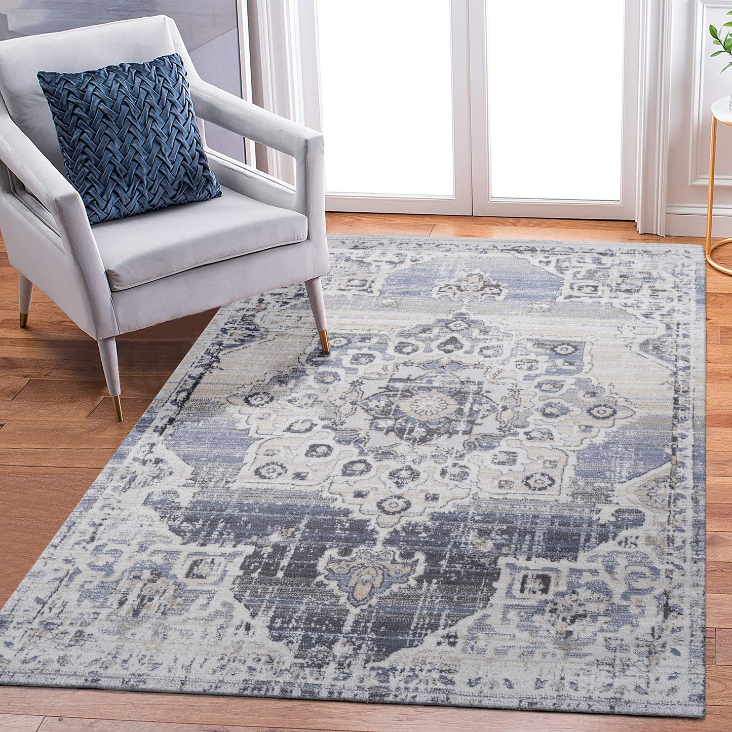 Distressed blue and beige Persian rug with intricate medallion pattern