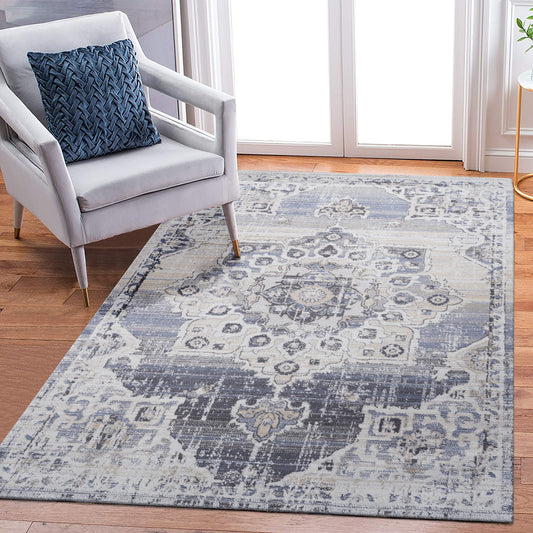 Distressed blue and beige Persian rug with intricate medallion pattern