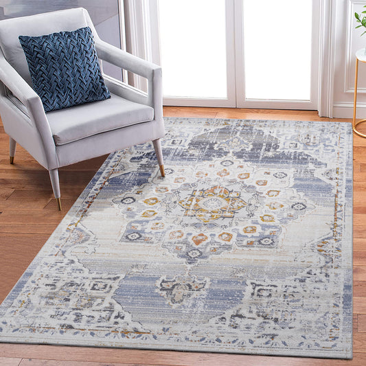 Distressed vintage Persian rug with floral motifs in grey blue and gold on a white background