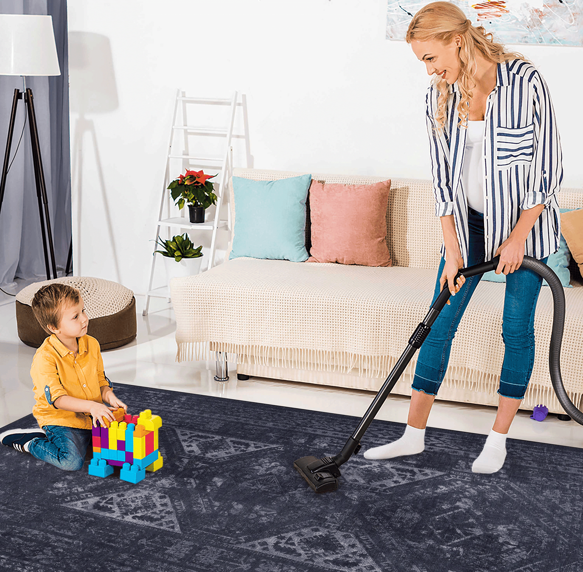 Distressed vintagestyle navy area rug with intricate geometric patterns for a modern living space