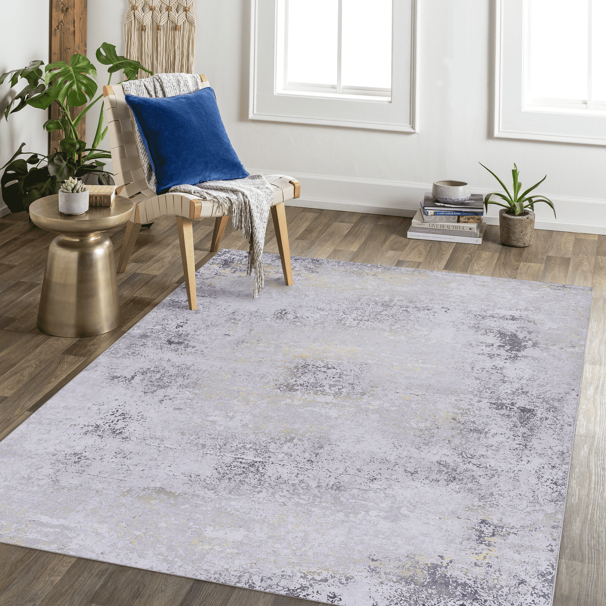Abstract grey and gold abstract area rug with distressed texture