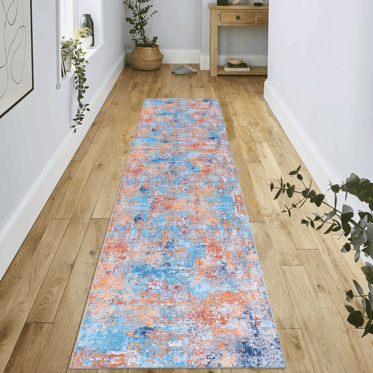 Abstract runner rug with distressed blue orange and white patterns