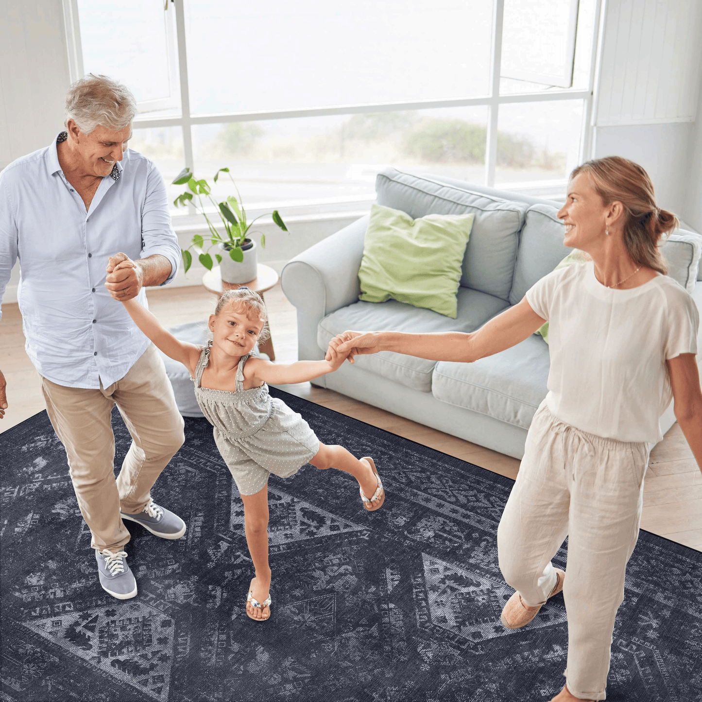 Dark gray area rug with intricate geometric patterns ideal for living rooms